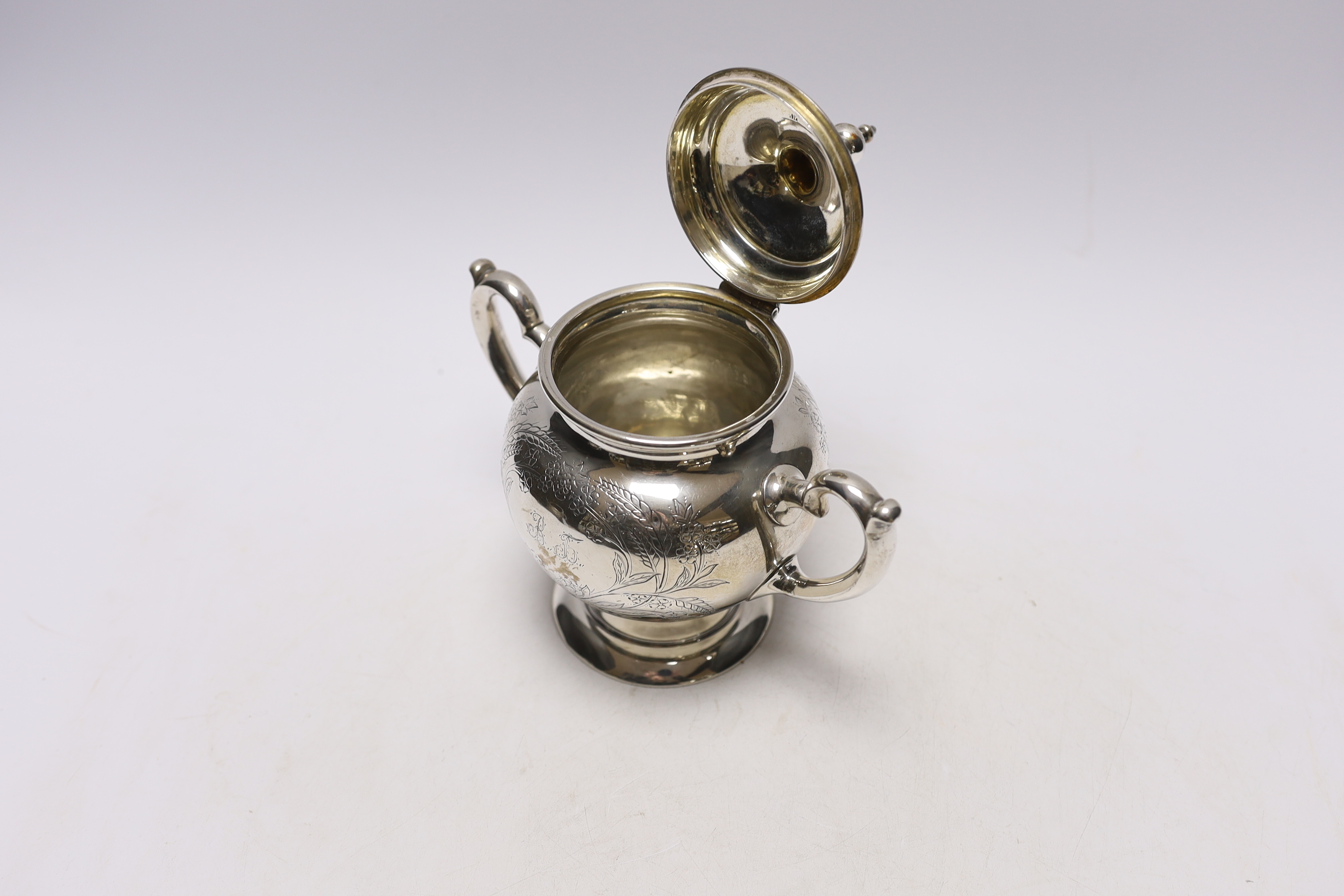 A late 19th century Russian 84 zolotnik two handled sugar bowl and hinged cover, unknown assay master, Moscow, 1883, height 18cm, 12.5oz.